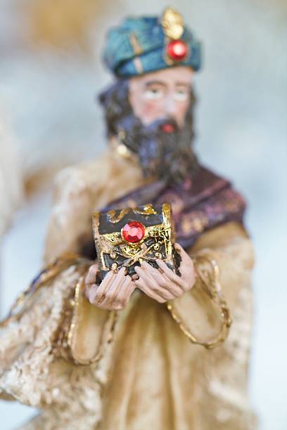 istock One of Magi offering gift in nativity scene 541150674