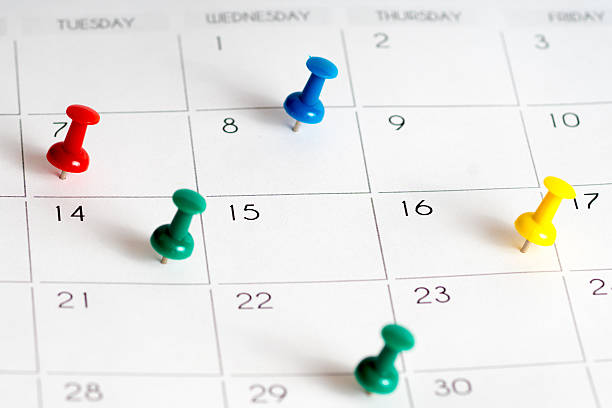 istock colorful pins on calendar grid 541152110