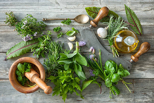 fresh herbs and spices on wooden table fresh kitchen herbs and spices on wooden table. Top view mezzaluna stock pictures, royalty-free photos & images