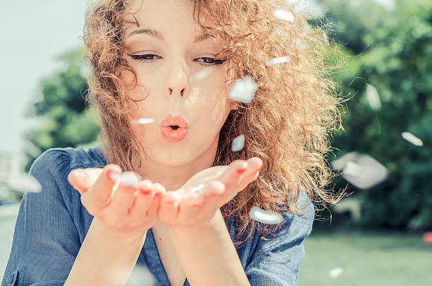 istock beautiful girl blowing on his hands 541153050