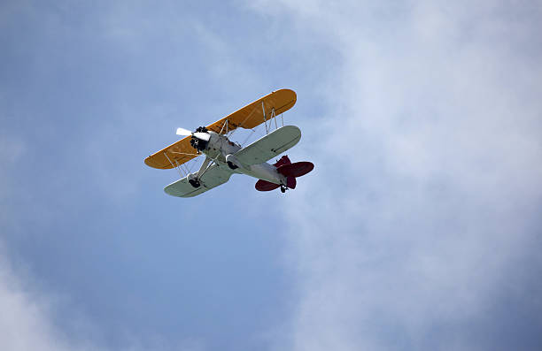istock Bi-wing, propeller driven airplane and clouds.  Copy space. Biplane. 541154310