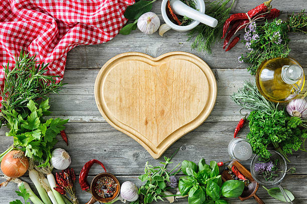 fresh herbs and spices on wooden table