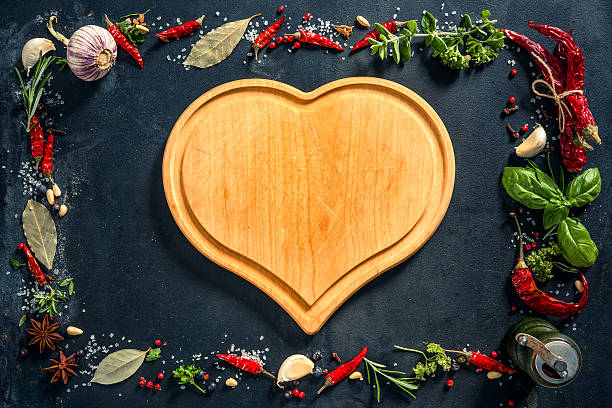 istock Herbs and spicesover black stone background 541265266