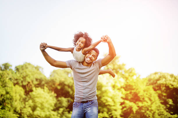 istock Father carrying daughter piggyback 541266460