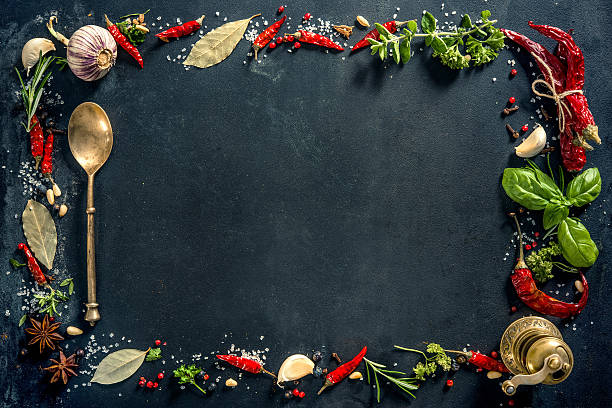 istock Herbs and spices over black stone background 541266972