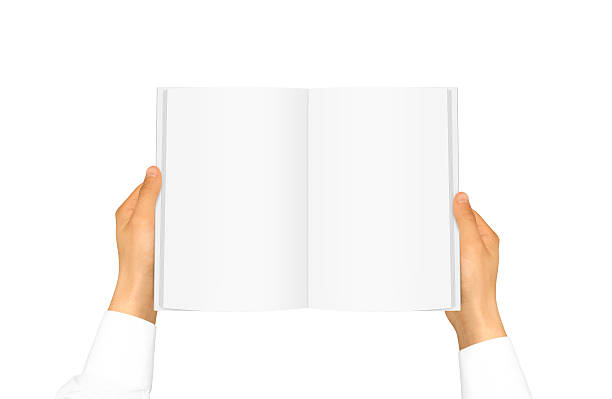 manga de camisa branca de mão segurando livro - book magazine open human hand - fotografias e filmes do acervo