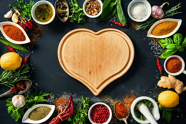 istock Herbs and spices over black stone background 541267448