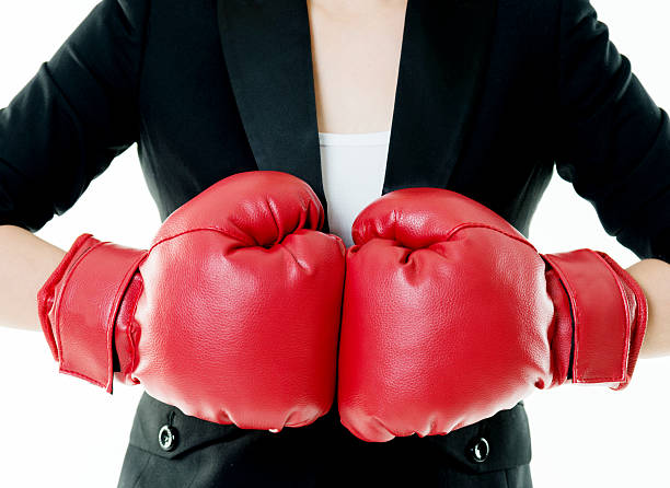 istock Businesswoman with boxing glove 541267980