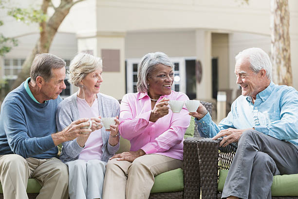 istock Multiracial senior friends outdoors drinking coffee 541268186