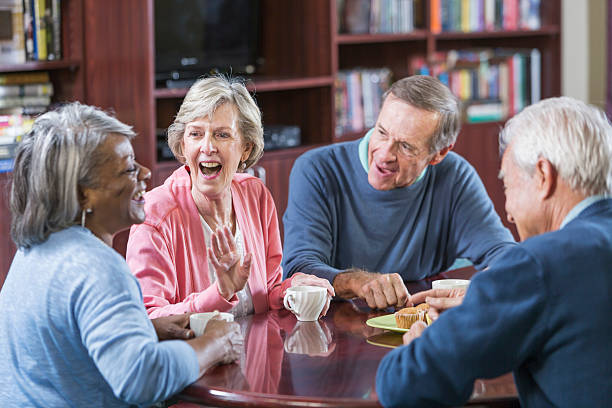 istock Multiracial group of seniors talking over coffee 541268218