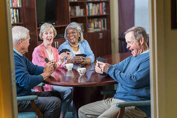 istock Multi-ethnic group of seniors playing card game 541268276