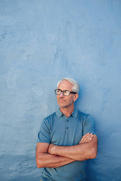 istock Mature man with glasses looking away at copy space 541269054