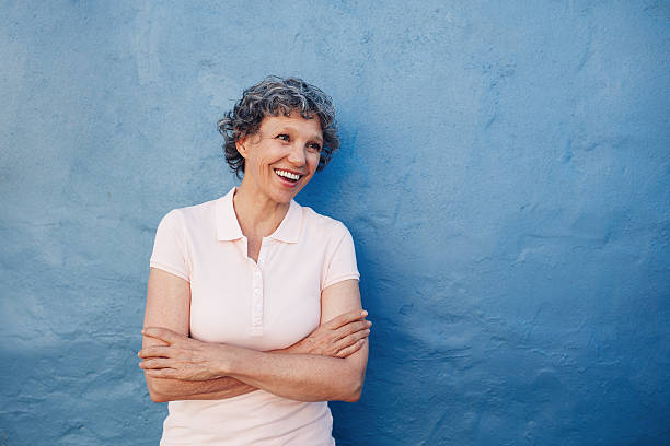 Senior woman looking happily at copy space