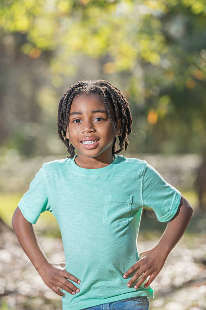 istock Young African American boy standing in park 541269946
