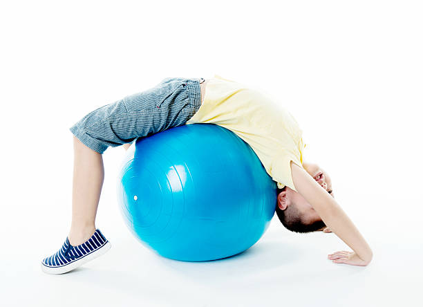 istock Little boy playing with a ball 541271092