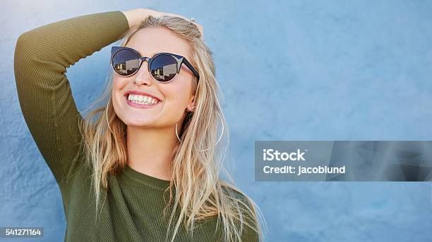 Stylish Young Woman In Sunglasses Smiling Stock Photo - Download Image Now - Sunglasses, Women, One Woman Only