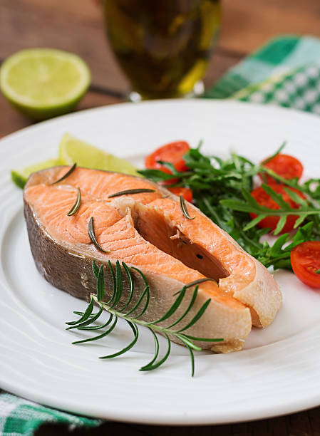 istock Cooked on steam salmon steak with vegetables. 541272014