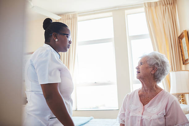 istock Female doctor visiting  patient for routine checkup 541272252