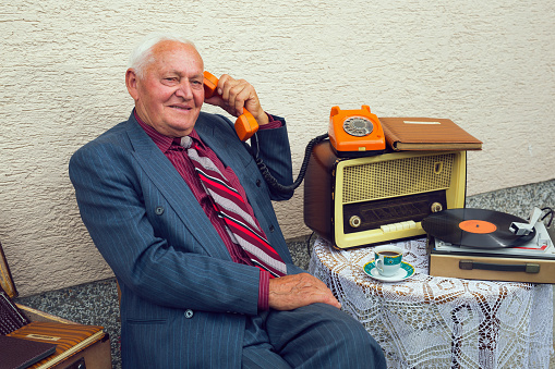 Portrait of smiling elderly old fashion  man outdoor