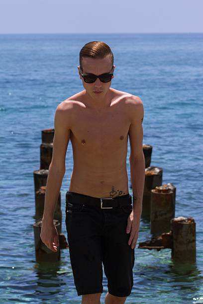 istock boy walking on the beach, Cyprus 541273626