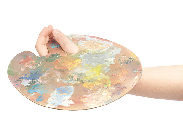 istock Hand holding a wooden palette isolated 541274536
