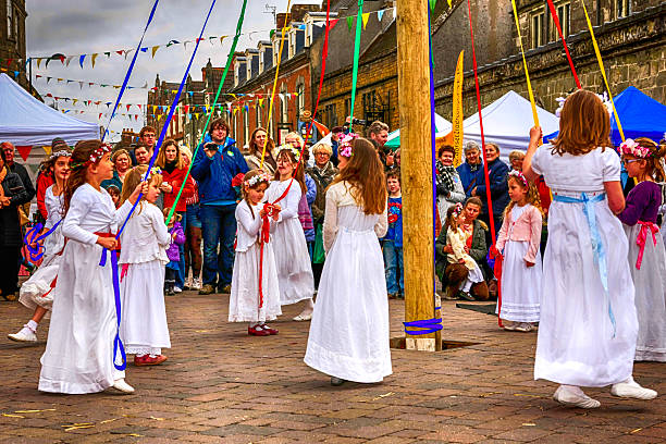 Shaftsbury, UK - May 5, 2012: Children dancing around the Maypole at Shaftsbury, UK
