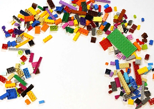 Colorado, USA - June 8, 2016: Studio shot of LEGO bricks in a pile with empty space available for text or image overlay.