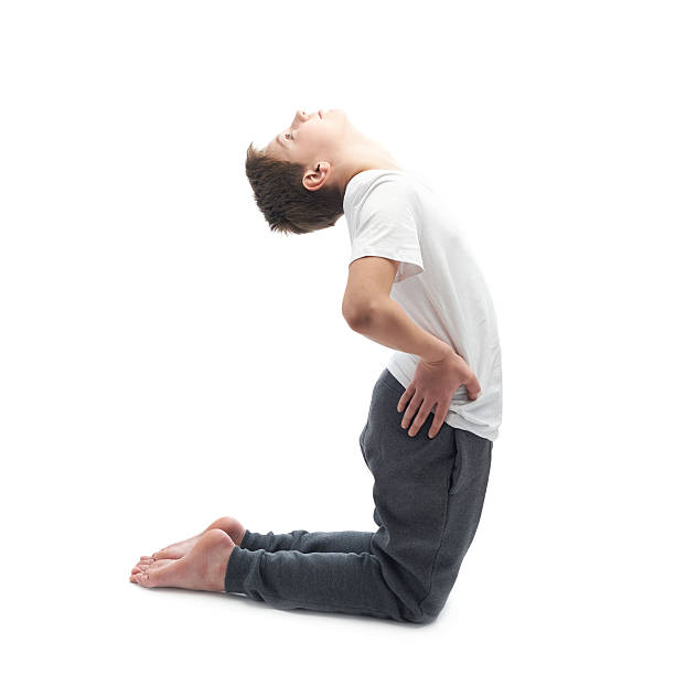 istock Young boy stretching or doing yoga 541279778