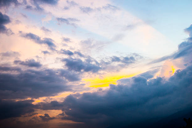 istock Golden Sun inside the clouds in the pinky blue sky 541280496