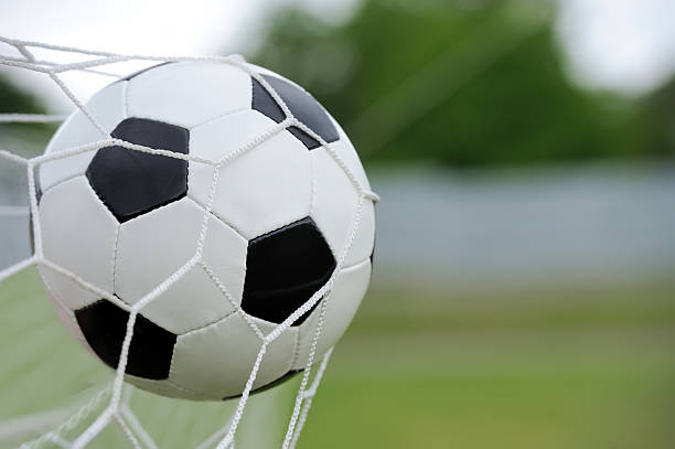 istock Soccer ball in goal 541282996