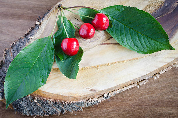 istock Fresh cherries on wooden background. Rustic style. 541284244
