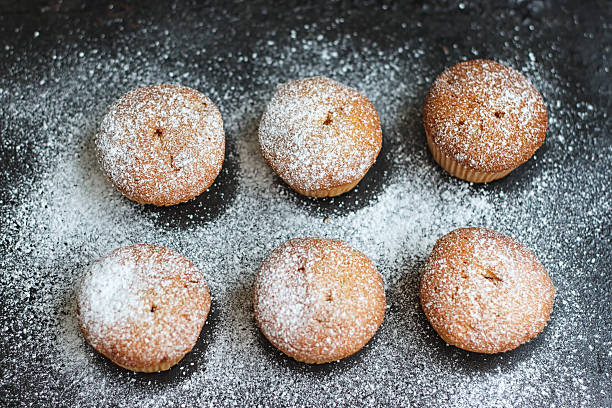 istock muffins in powdered sugar on a dark 541284976