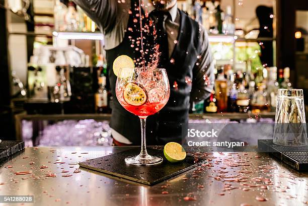 Barman Is Making Cocktail At Night Club Stock Photo - Download Image Now - Cocktail, Bartender, Bar - Drink Establishment