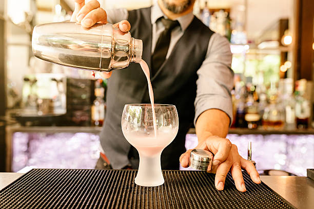 istock Barman is making cocktail at night club. 541288620