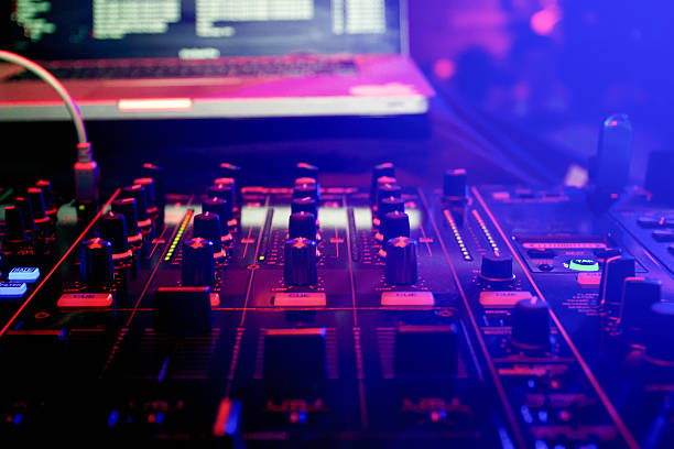 istock Dj desk with illuminated buttons in the nightclub 541289522