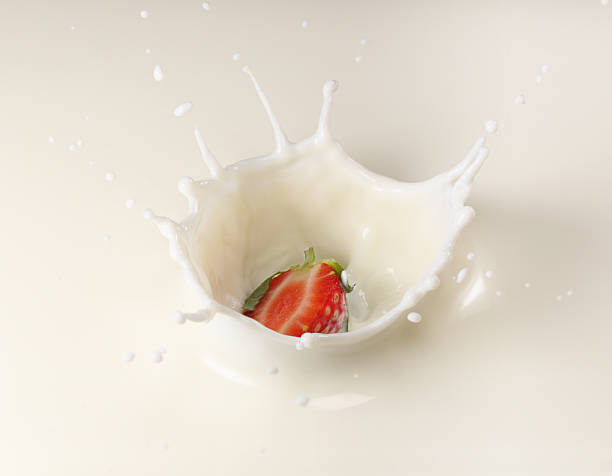 istock Splashing Strawberry into Milk 541289760