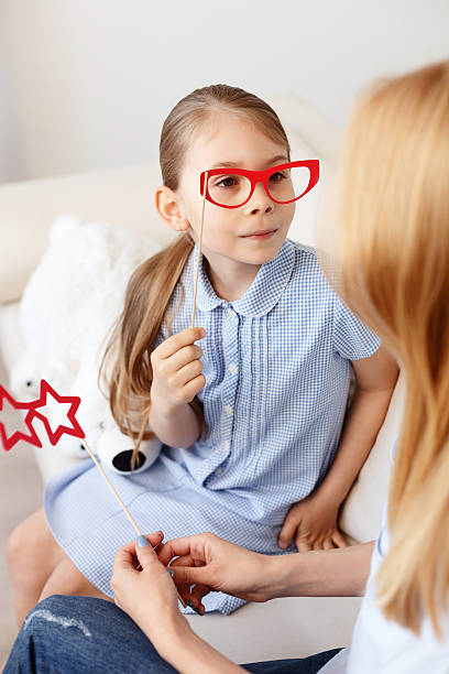 istock Mother playing with her daughter at home 541289774