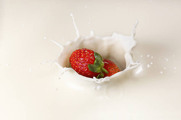 istock Splashing Strawberry into Milk 541289812