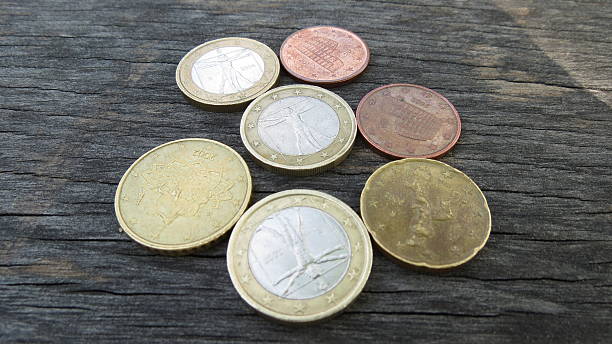 istock Euro coins over wood background 541290050