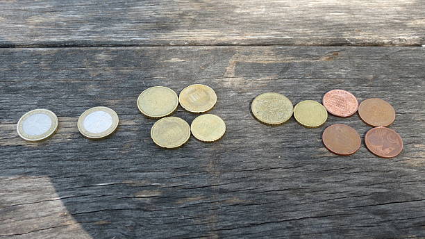 istock Euro coins over wood background 541290062