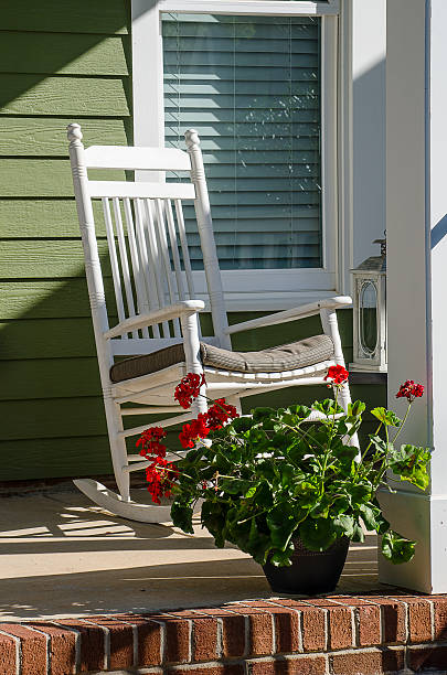 istock Rocking Chair on a Front Porch with Geraniums 541292522