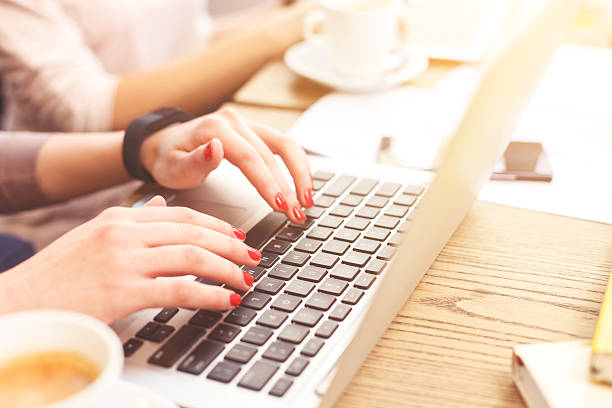 istock Cheerful young women working on laptops together 541292586
