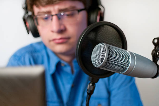 istock Radio Host or Podcaster Working at His Desk 541292618