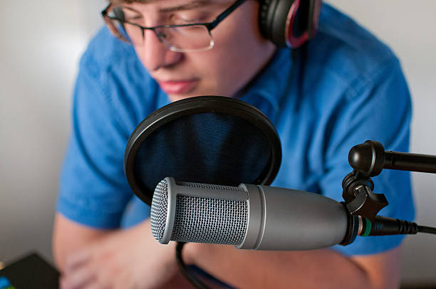 istock Radio Host or Podcaster Working at His Desk 541292712