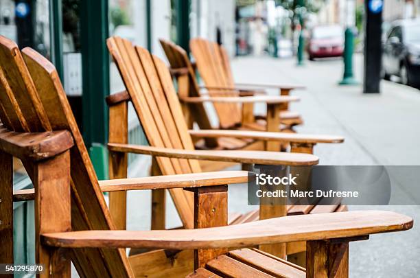 Row Of Wooden Chairs On Sidewalk Stock Photo - Download Image Now - Sherbrooke - Quebec, Quebec, Canada