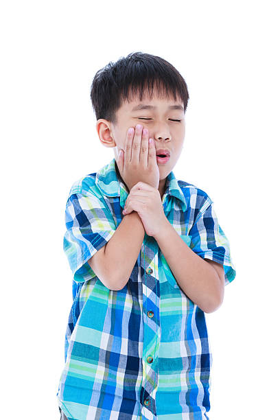 istock Asian handsome boy is having toothache. Isolated on white backgr 541297804