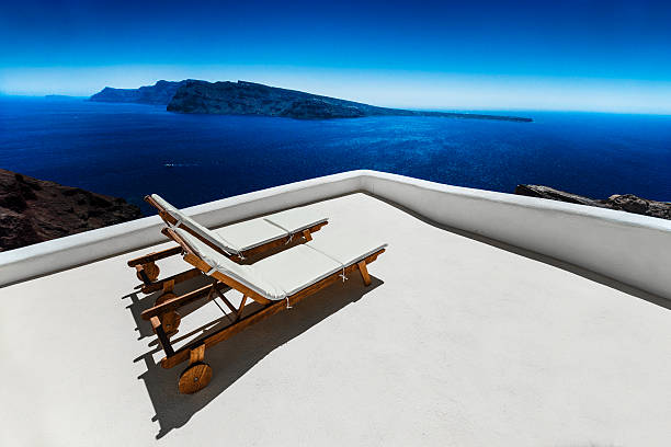 istock Empty Sun Lounge Chair on balcony In Santorini at Sunrise 541297996