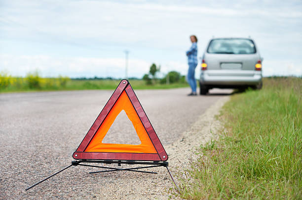 istock Woman waits help near broken car on road 541299704