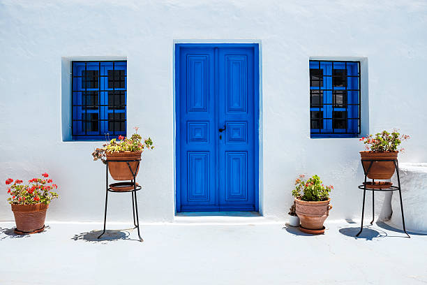 traditional white houses with blue doors in santorini, greece - santorini door sea gate bildbanksfoton och bilder