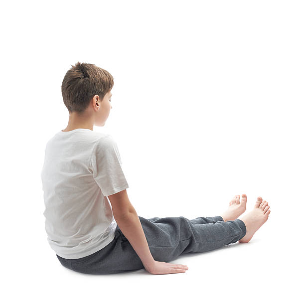 istock Young boy stretching or doing yoga 541300326